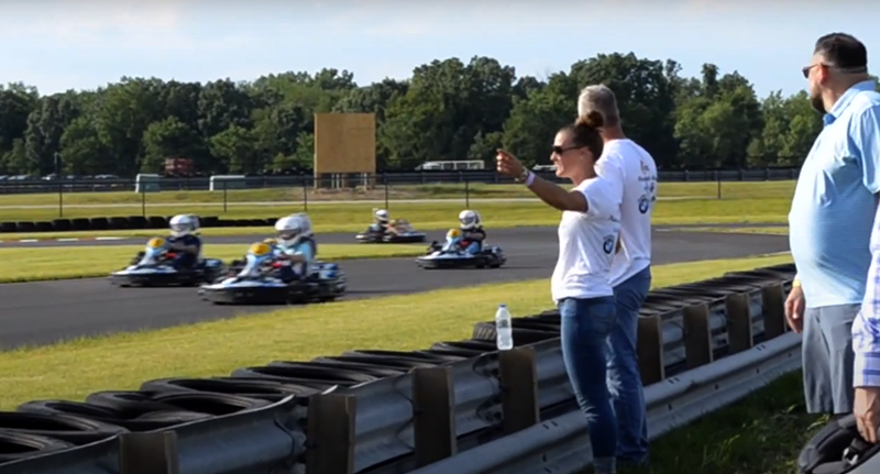 Go Karts race past a handful of spectators